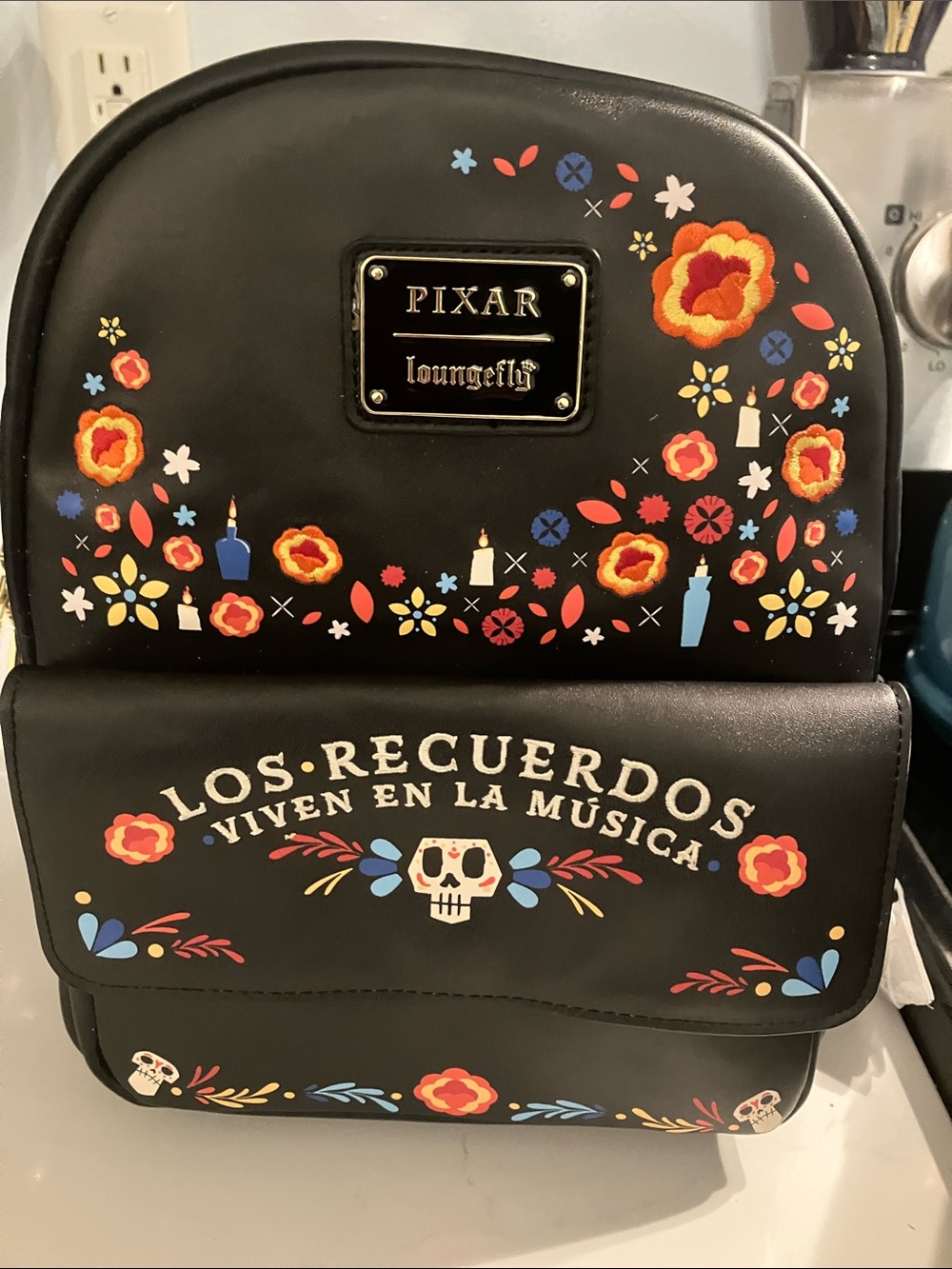 Loungefly Black Floral Pixar Mini Backpack with Colorful Accents